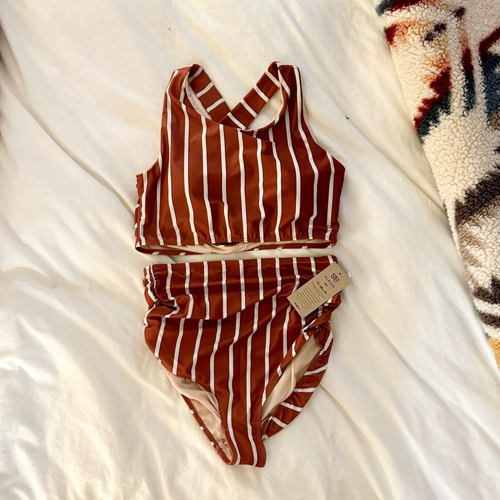 NEVER WORN 2 piece swimsuit: Top is a  size Large, bottoms are a Mediu